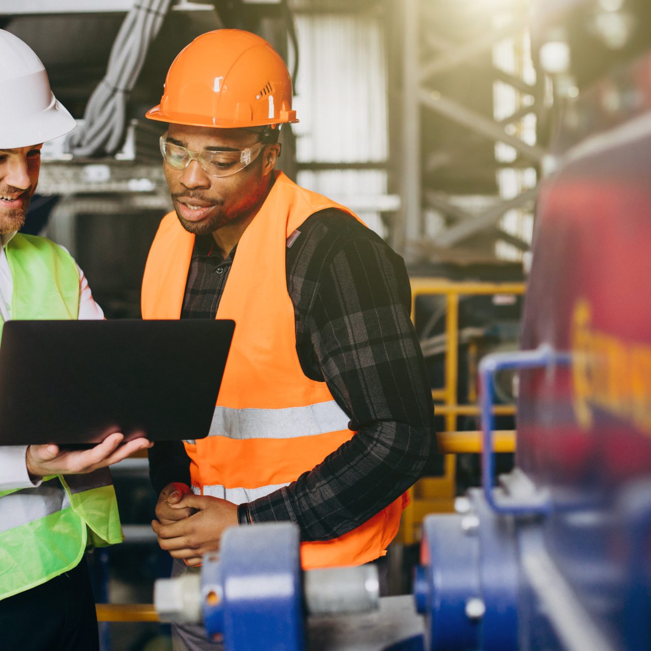 Inspector and african american worker in a factory